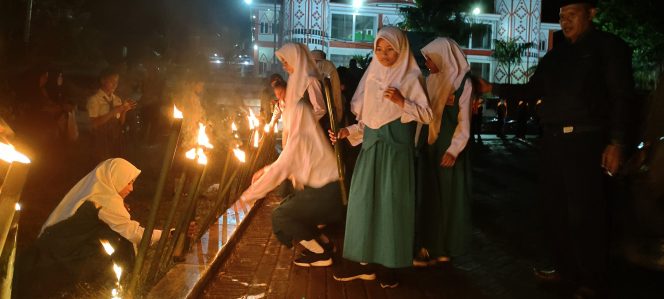
 Polres & Pemda Halbar Gelar Taptu Peringatan HUT RI ke 77 Tahun